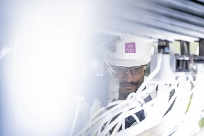 emplyee working at electrolyzer